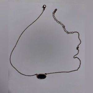 Gold necklace with purple stone